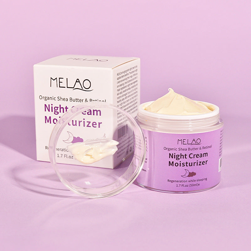 Crème de nuit réparatrice à base de rétinol pour le visage, contenant une texture riche et un emballage blanc et violet.